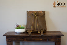 Load image into Gallery viewer, Cowhide and Tooled Leather Backpack
